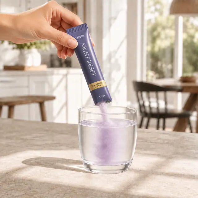 Night Reset stick pack being poured into a glass of water