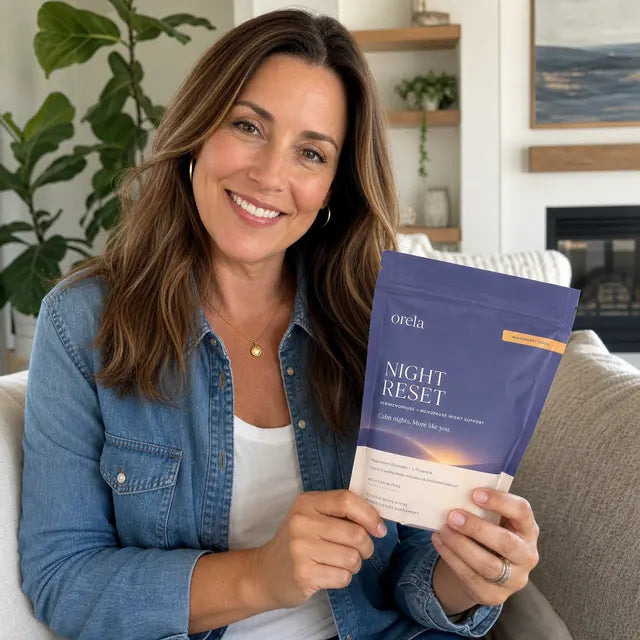 Customer holding an Orela Night Reset pouch at home