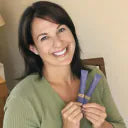 Customer holding two Orela Night Reset stick packs