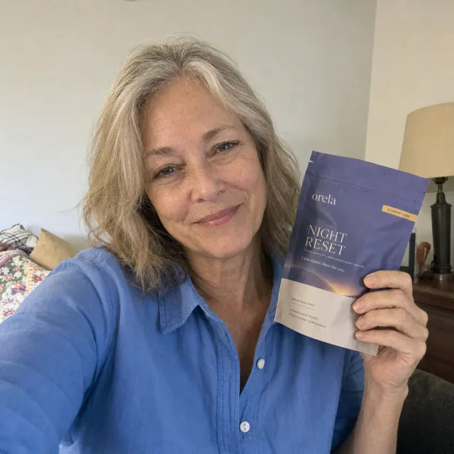 Customer smiling with Orela Night Reset pouch