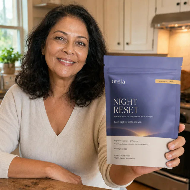 Customer holding Orela Night Reset pouch in a kitchen